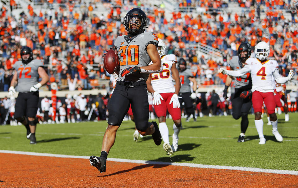 STILLWATER, OK - OCTOBER 24:  Running back Chuba Hubbard #30 of the Oklahoma State Cowboys crosses the goal line after breaking free for a 32-yard touchdown against the Iowa State Cyclones in the second quarter at Boone Pickens Stadium on October 24, 2020 in Stillwater, Oklahoma.  (Photo by Brian Bahr/Getty Images)