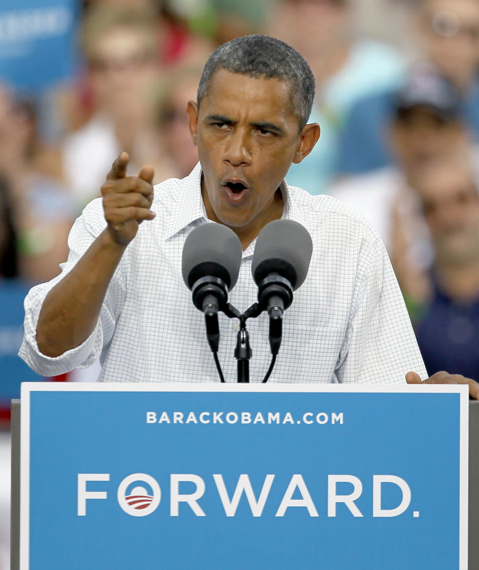 President Barack Obama addresses the crowd during a campaign stop Wednesday, Aug. 15, 2012, in Davenport, Iowa. (AP Photo/Charles Rex Arbogast)