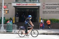 A cyclist passes the New York Presbyterian Hospital where U.S. President Donald Trump's brother Robert has been admitted