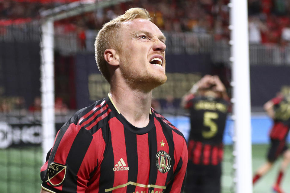 FILE - In this March 10, 2019, file photo, Atlanta United midfielder Jeff Larentowicz reacts after just missing a goal against FC Cincinnati during the second half of an MLS soccer in Atlanta. When Major League Soccer and its players came to agreement on a new collective bargaining agreement back in February, there was a genuine feeling of accomplishment on both sides. Those pre-pandemic positive vibes are now gone, at least in how the players feel toward the league and ownership. (Curtis Compton/Atlanta Journal-Constitution via AP, File)
