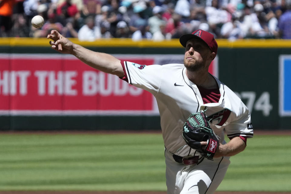 Arizona Diamondbacks pitcher Merrill Kelly throws against the New York Yankees in the first inning during a baseball game, Wednesday, April 3, 2024, in Phoenix. (AP Photo/Rick Scuteri)