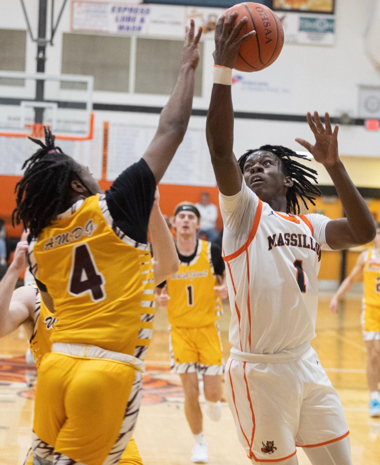 Massillon's Jadyce Thigpen shoots over pressure from Walsh Jesuit's Jesse James.