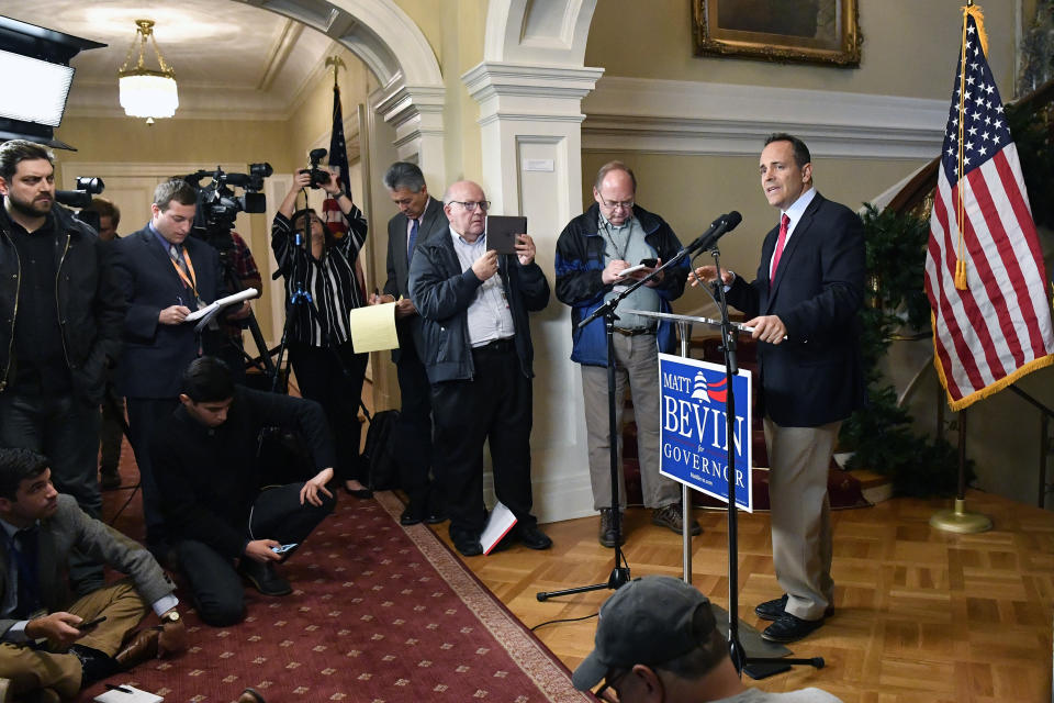 Kentucky Governor Matt Bevin, right, announces his intent to call for a remcanvass of the voting results from Tuesday's gubernatorial elections during a press conference at the Governor's Mansion in Frankfort, Ky., Wednesday, Nov. 6, 2019. (AP Photo/Timothy D. Easley)