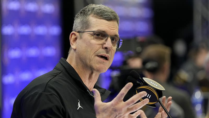 Michigan head coach Jim Harbaugh is interviewed during media day ahead of the national championship NCAA College Football Playoff game between Washington and Michigan Saturday, Jan. 6, 2024, in Houston.