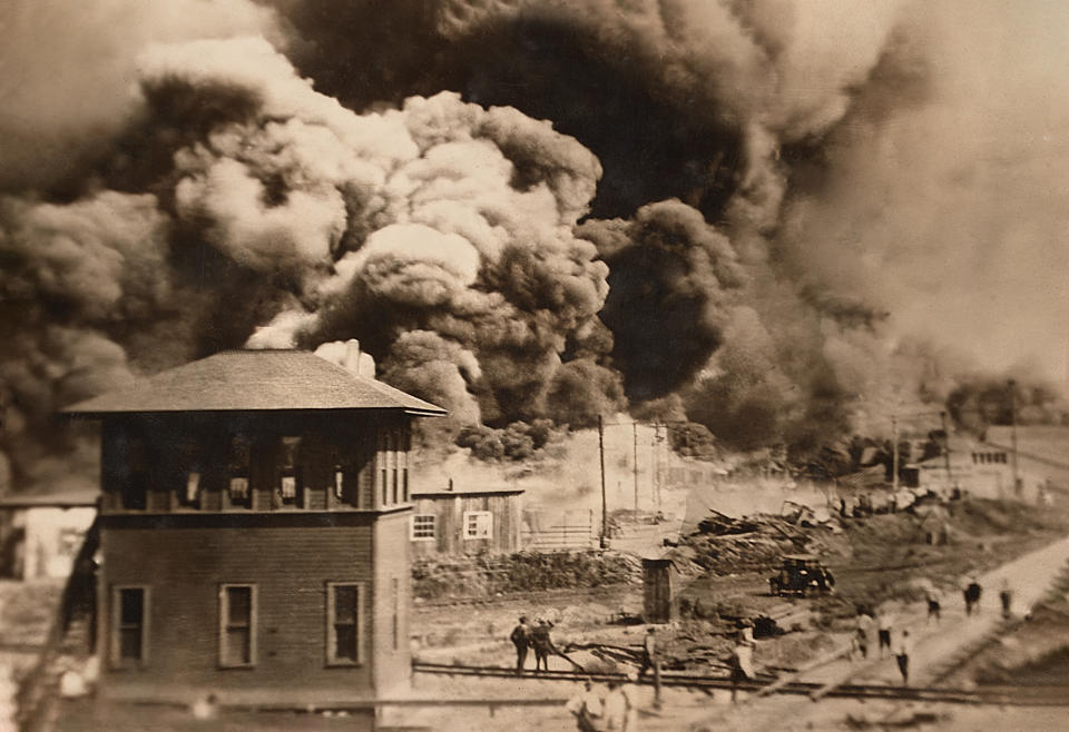 Buildings burning in the Greenwood District of Tulsa, Oklahoma, known as "Black Wall Street," June 1921. (Unidentified Artist)