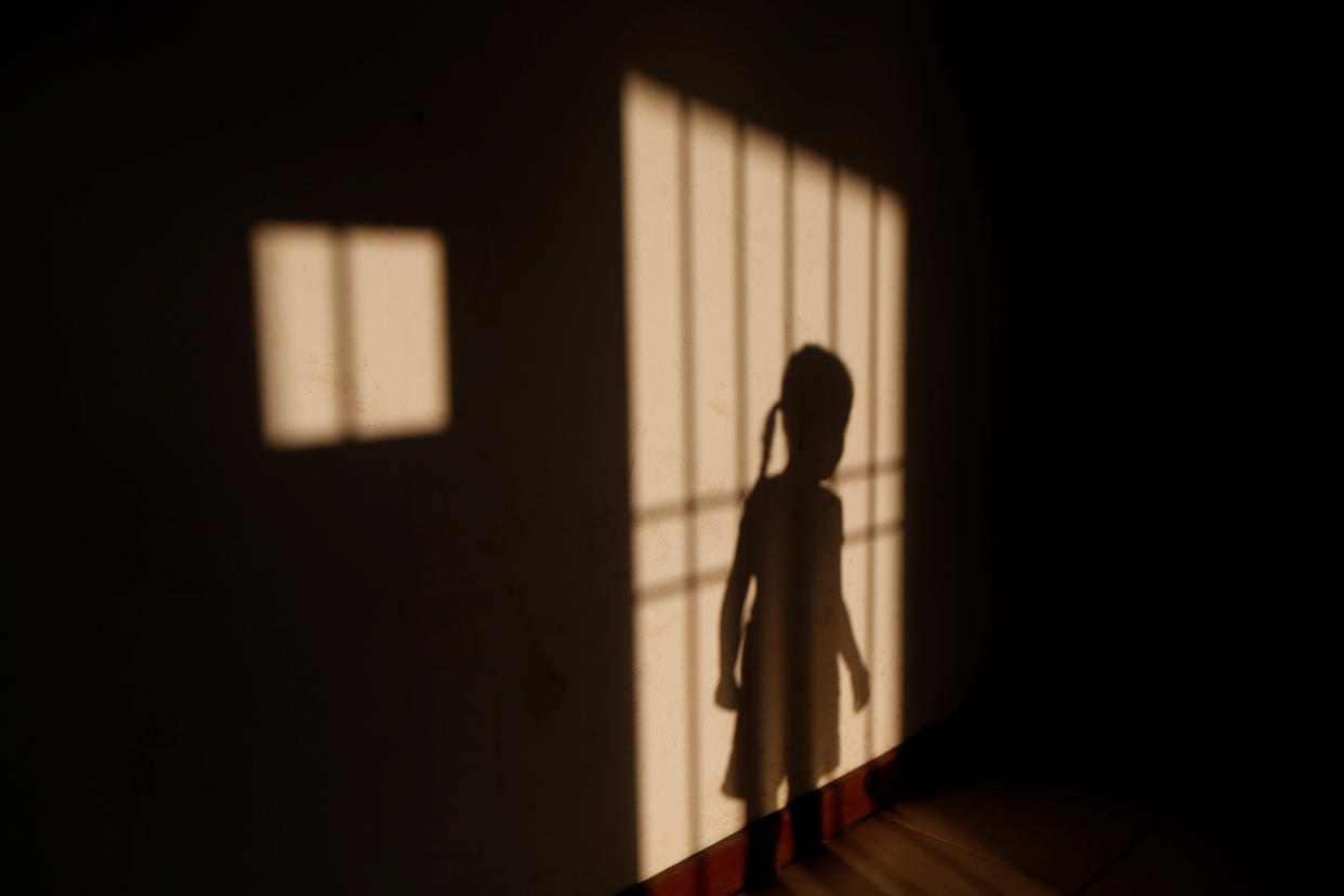 The niece of Maroly Bastardo, who, along with her children, her husband's sister, uncle and father, disappeared in the Caribbean Sea after boarding a smuggler's boat during an attempt to cross from Venezuela to Trinidad and Tobago, at her relatives' home in El Tigre, Venezuela, on June 3. (Photo: Ivan Alvarado/Reuters)