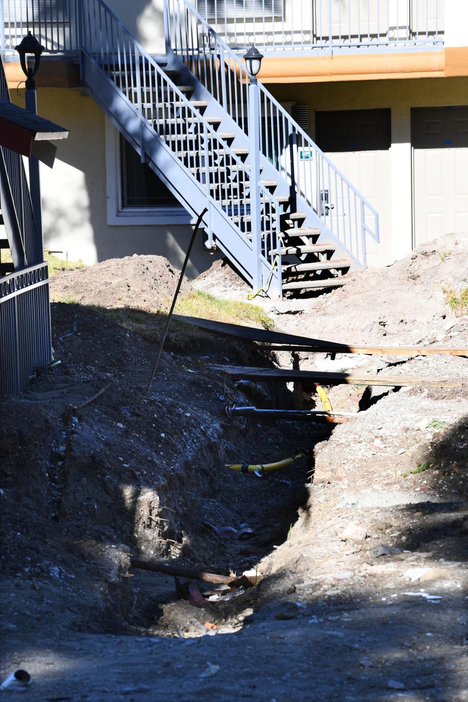 Piles of stone and masonry sit on an unfinished driveway of the former Quality Inn & Suites in Thousand Oaks on Wednesday. The property was slated to become permanent housing for those previously homeless. Shangri-La Industries, which owns the property, is in financial trouble and has defaulted on loans for this and other properties.