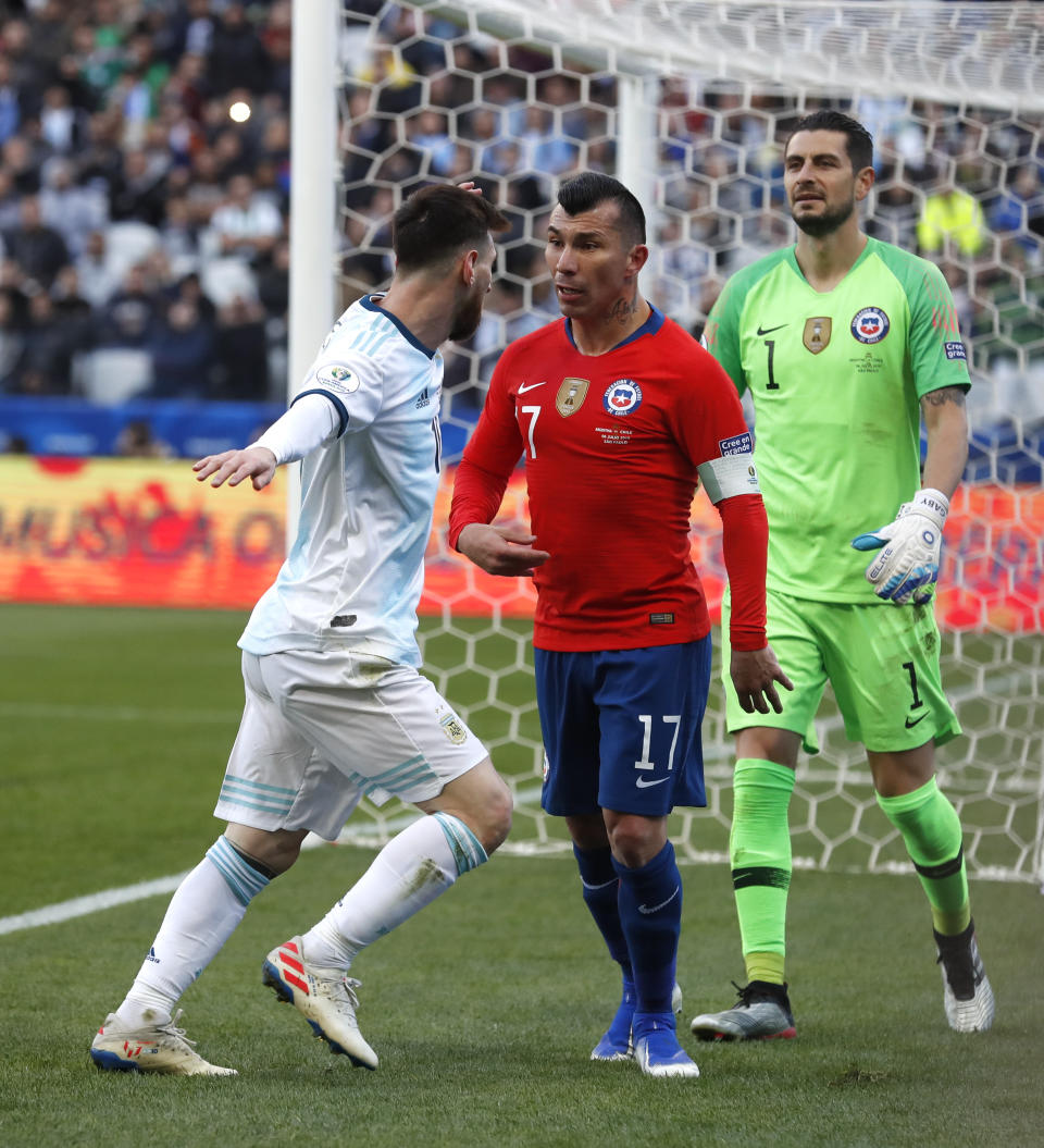 Argentina's Lionel Messi, left, and Chile's Gary Medel argue during Copa America third-place soccer match at the Arena Corinthians in Sao Paulo, Brazil, Saturday, July 6, 2019. (AP Photo/Victor R. Caivano)