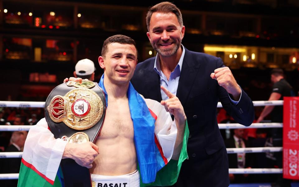 Israil Madrimov poses for a photo whilst holding the belt with Eddie Hearn, Chairman of Matchroom Sport, following victory over Magomed Kurbanov (not pictured) after the WBA World Super Welterweight title fight between Israil Madrimov and Magomed Kurbanov on the Knockout Chaos boxing card at the Kingdom Arena on March 08, 2024 in Riyadh, Saudi Arabia