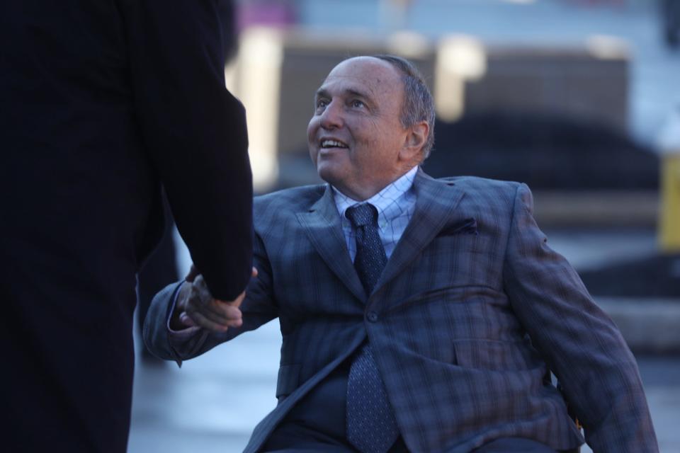 Robert Morgan greets his lawyer before they head into federal court in Rochester, April 12, 2022. 