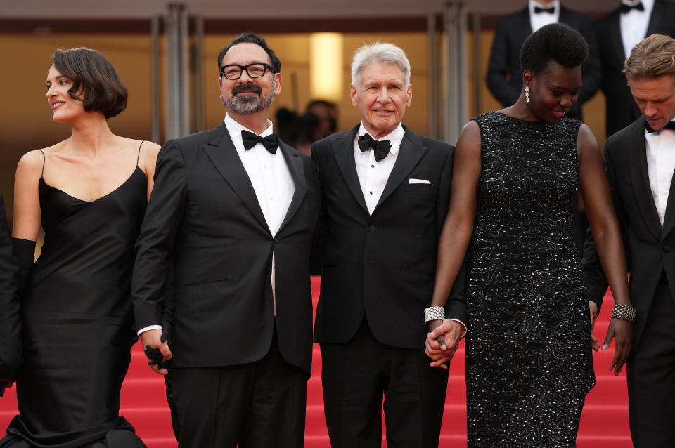 Phoebe Waller-Bridge, from left, director James Mangold, Harrison Ford, Shaunette Renee Wilson, and Boyd Holbrook pose for photographers upon arrival at the premiere of the film 'Indiana Jones and the Dial of Destiny' at the 76th international film festival, Cannes, southern France, Thursday, May 18, 2023. (Photo by Scott Garfitt/Invision/AP)