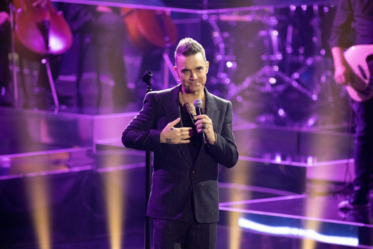 FRIEDRICHSHAFEN, GERMANY - NOVEMBER 19: Robbie Williams performs on stage during the 