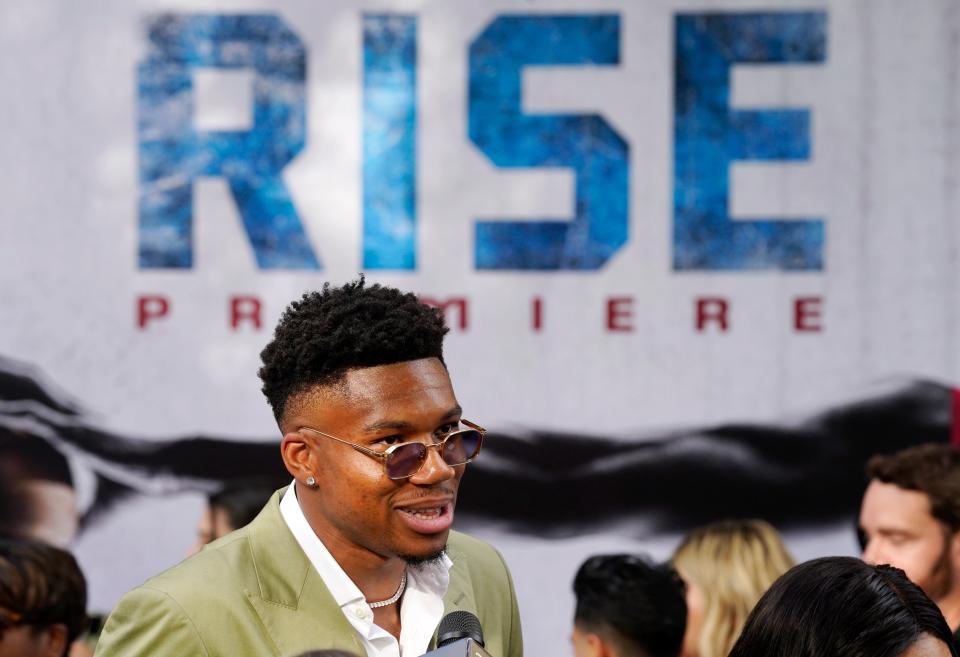 Giannis Antetokounmpo is interviewed on the red carpet at the premiere of the Disney+ film "Rise" at Walt Disney Studios in Burbank, California.