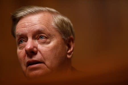 FILE PHOTO: Chairman Lindsey Graham speaks as FBI Director Christopher Wray testifies before a Senate Judiciary Committee hearing on "Oversight of the Federal Bureau of Investigation" on Capitol Hill in Washington