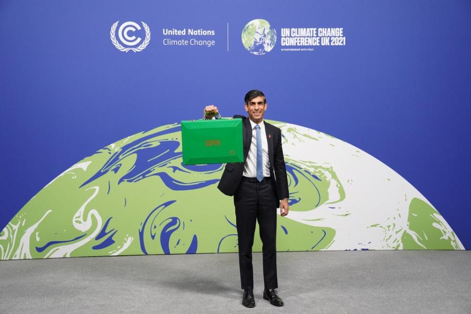 Chancellor Rishi Sunak holds his Green Box at the Cop26 summit (Stefan Rousseau/PA) (PA Wire)