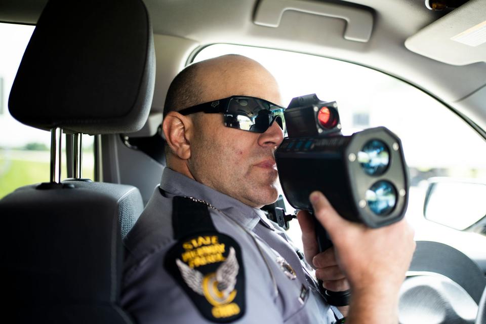 Jul 26, 2023; Columbus, OH, United States; State Highway Patrol trooper Bill Duerson, uses a radar gun to catch speeders during their zero-tolerance speeding and reckless driving enforcement day.