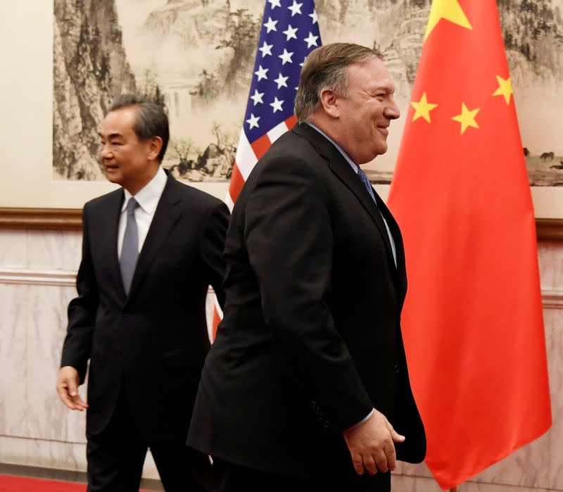 FILE PHOTO: U.S. Secretary of State Mike Pompeo is seen near Chinese State Councilor and Foreign Minister Wang Yi before a meeting at the Diaoyutai State Guesthouse in Beijing