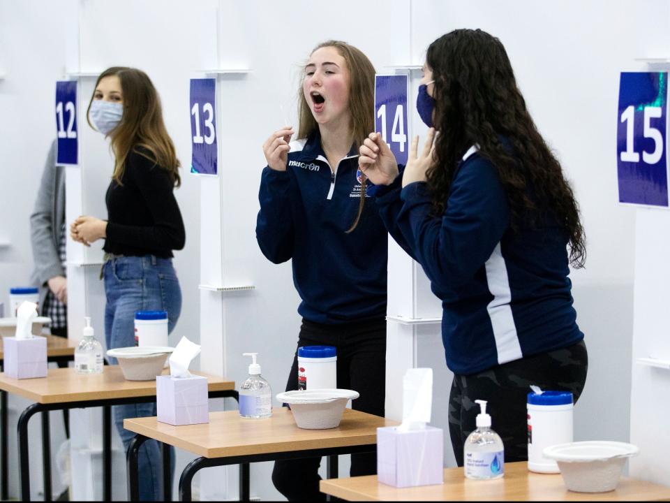 Students get a Covid-19 test at St Andrews University in Scotland ahead of the Christmas holiday (PA)