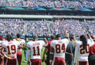 <p>Rashad Ross #19, DeSean Jackson #11, Niles Paul #84, and Greg Toler #20 of the Washington Redskins raise their fists during the national anthem prior to the game against the New York Giants at MetLife Stadium on September 25, 2016 in East Rutherford, New Jersey. (Photo by Michael Reaves/Getty Images) </p>