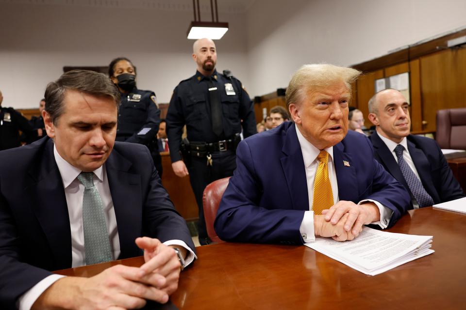Former President Donald Trump sits in the courtroom with attorneys Todd Blanche (L) and Emil Bove at Manhattan Criminal Court on May 14, 2024 in New York City.