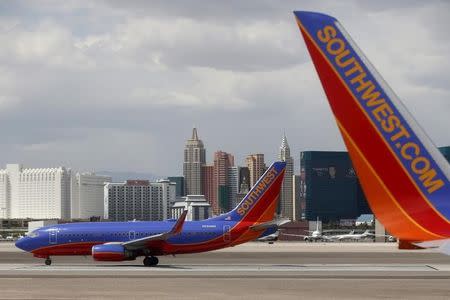 Southwest Airlines planes are seen in front of the Las Vegas strip, Nevada, United States April 23, 2015. REUTERS/Lucy Nicholson