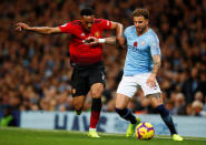 Soccer Football - Premier League - Manchester City v Manchester United - Etihad Stadium, Manchester, Britain - November 11, 2018 Manchester United's Anthony Martial in action with Manchester City's Kyle Walker Action Images via Reuters/Jason Cairnduff