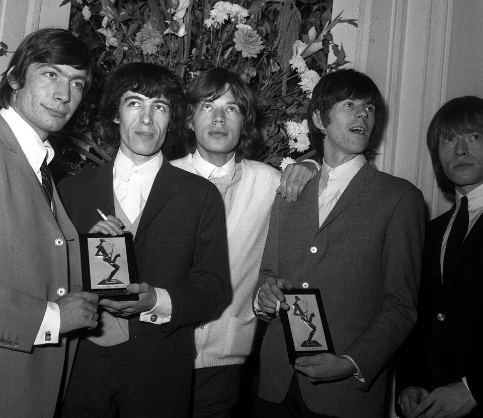 The Rolling Stones, who topped The Beatles, win the vocal/instrumental best group award in the British section of the Melody Maker poll. Pictured at the Variety Club luncheon, at the Savoy Hotel, London.   (Photo by PA Images via Getty Images)