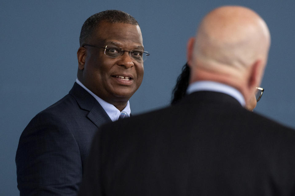 Michael Cox, a candidate for the Ann Arbor police chief, speaks with community members in the lobby of the Justice Center, Wednesday, May 15, 2019 in Ann Arbor. Cox, a former Boston police officer who was beaten more than 25 years ago by colleagues who mistook him for a suspect in a fatal shooting, will be the new leader of the city's police department, Boston Mayor Michelle Wu announced Wednesday, July 13, 2022. The commissioner post is a homecoming for Cox, 57, a city native who served in multiple roles with the Boston Police Department before becoming the police chief in Ann Arbor, Michigan, in 2019. Cox is expected to take the helm in Boston next month. (Ben Allan Smith/Ann Arbor News via AP)