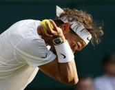 Rafael Nadal of Spain prepares to serve during his match against Dustin Brown of Germany at the Wimbledon Tennis Championships in London, July 2, 2015. REUTERS/Stefan Wermuth