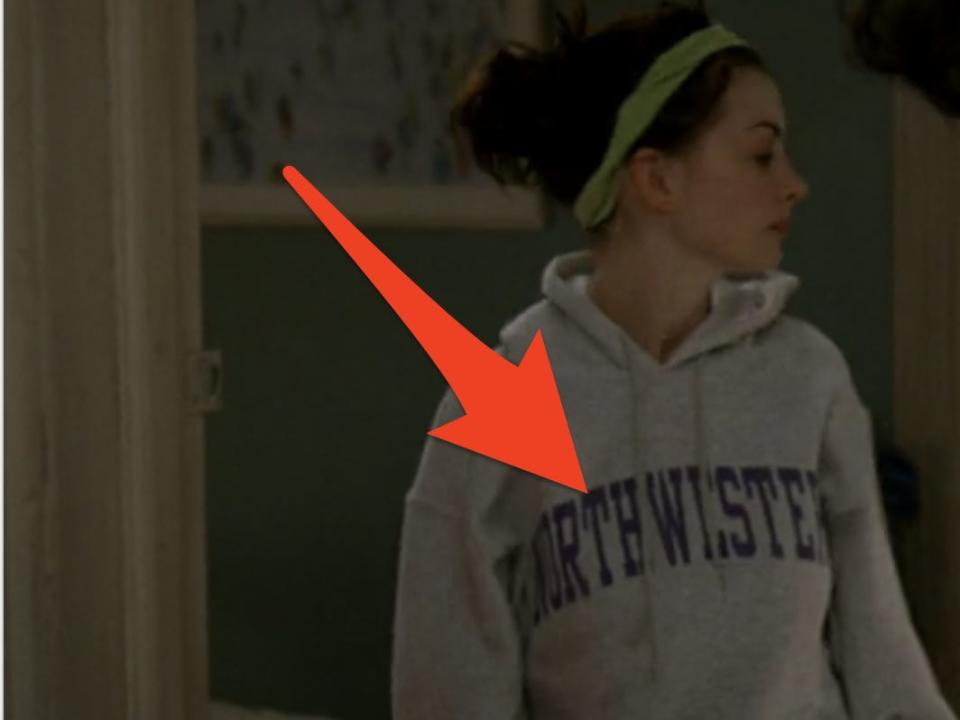 anne hathaway as andy in devil wears prada wearing a northwestern sweatshirt