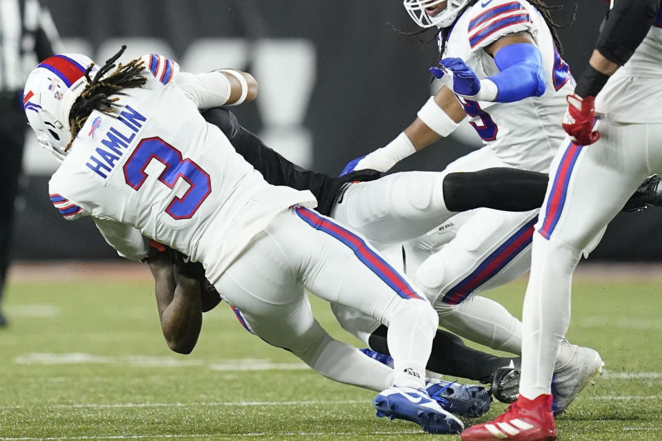 Cincinnati Bengals wide receiver Tee Higgins (85) collides with Buffalo Bills safety Damar Hamlin (3) during the first half of an NFL football game, Monday, Jan. 2, 2023, in Cincinnati. Hamlin was injured on the play. Tonight's Buffalo Bills-Cincinnati Bengals game has been postponed after Buffalo Bills' Damar Hamlin collapsed, NFL Commissioner Roger Goodell announced. (AP Photo/Joshua A. Bickel)