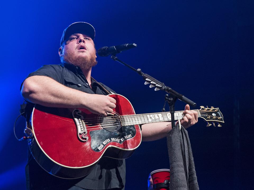 Luke Combs looks into the crowd at a sold-out PPG Paints Arena. {Jason L. Nelson/For The Times]