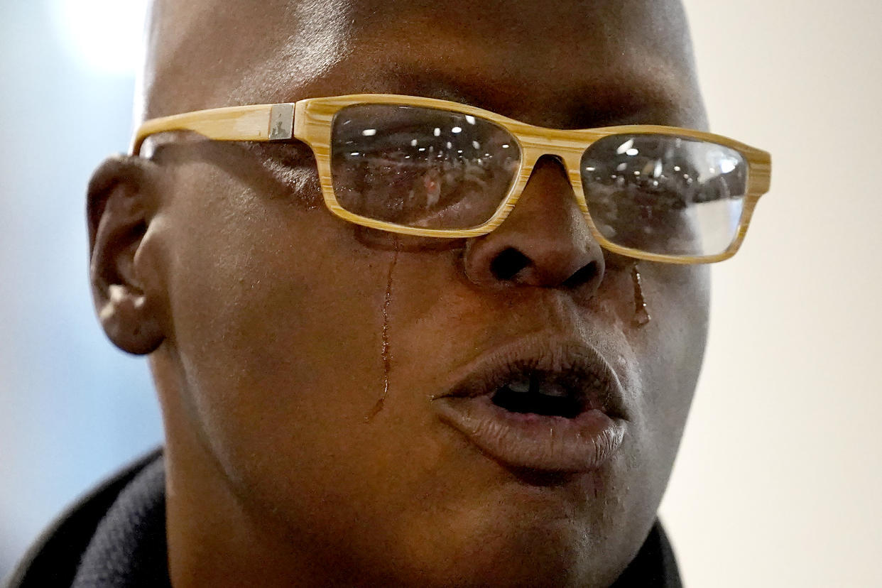 Kia Walker, mother of Tommy Schaefer, cries as she talks with reporters after Heather Mack, and Mack's daughter, Walker's granddaughter Stella, arrived back in the U.S. at O'Hare International Airport Wednesday, Nov. 3, 2021, in Chicago. Mack was immediately taken into federal custody on federal murder conspiracy charges. Both Mack and Schaefer were convicted in 2015 of the murder of Mack's mother, Sheila von Wiese-Mack in Bali. (AP Photo/Charles Rex Arbogast)