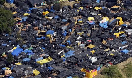 A general view shows shacks belonging to members of the Brazil's Homeless Workers' Movement (MTST) at the "People's World Cup" camp, which houses an estimate of 2,800 families of the movement, in the district of Itaquera near Sao Paulo's World Cup stadium, in Sao Paulo May 8, 2014. REUTERS/Paulo Whitaker