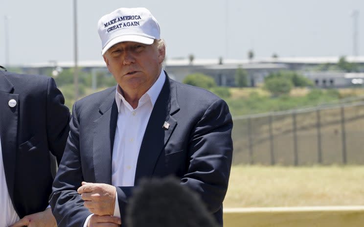 Trump stands near the U.S. southern border, outside Laredo, Texas, last year. (Rick Wilking/Reuters)