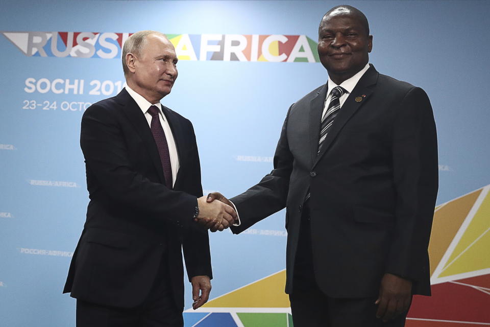 Russian President Vladimir Putin, left, and President of the Central African Republic Faustin Archange Touadera pose for a photo during their meeting on the sideline of Russia-Africa summit in the Black Sea resort of Sochi, Russia, Wednesday, Oct. 23, 2019. (Sergei Fadeyechev, TASS News Agency Pool Photo via AP)