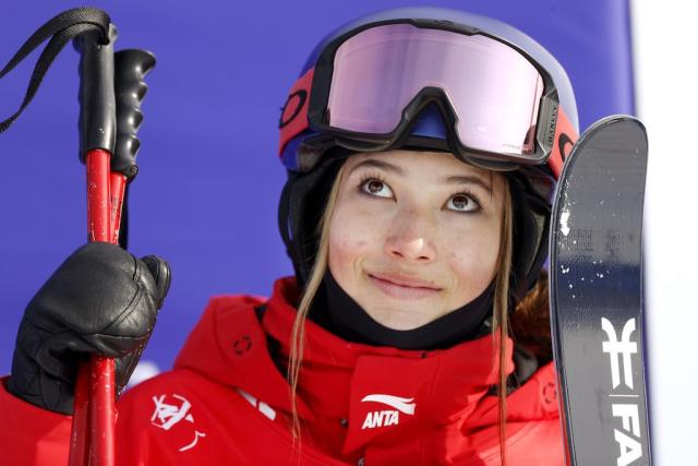 Olympic Skier & Model Eileen Gu Poses With Her Gold Medals in Red Fuzzy  Bucket Hat