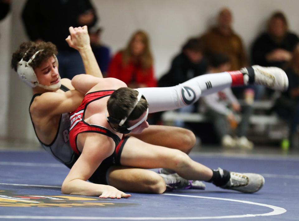 Byram Hills/Briarcliff/Valhalla/WestlakeÕs Nick Fortugno and RyeÕs Ronan Sutter wrestle in the 124-pound weight class during the dual meet quarterfinals at Byram Hills High School Dec. 19, 2023. Fortugno won the match.
