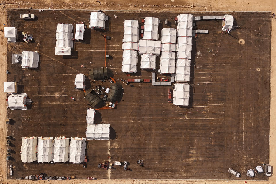 A football court is turned to a French field hospital, following recent flooding caused by deadly Mediterranean storm Daniel, in Derna, Libya, Monday, Sept. 18, 2023. (AP Photo/Muhammad J. Elalwany)