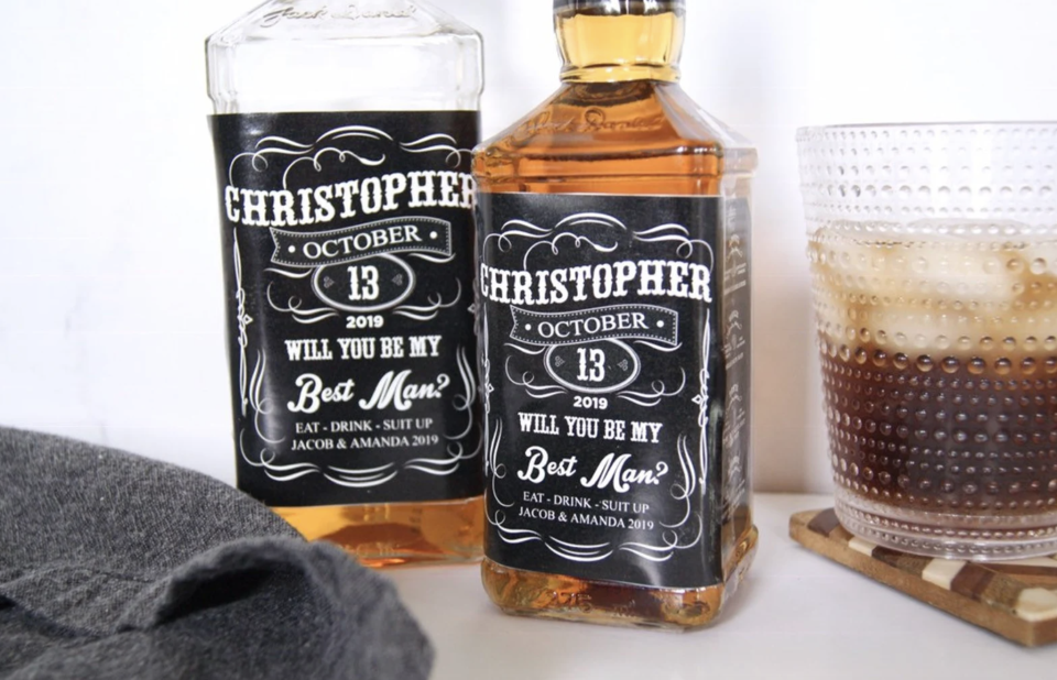 Personalized Groomsmen Proposal Labels on Black Label Whiskey Bottle (Photo via Etsy)