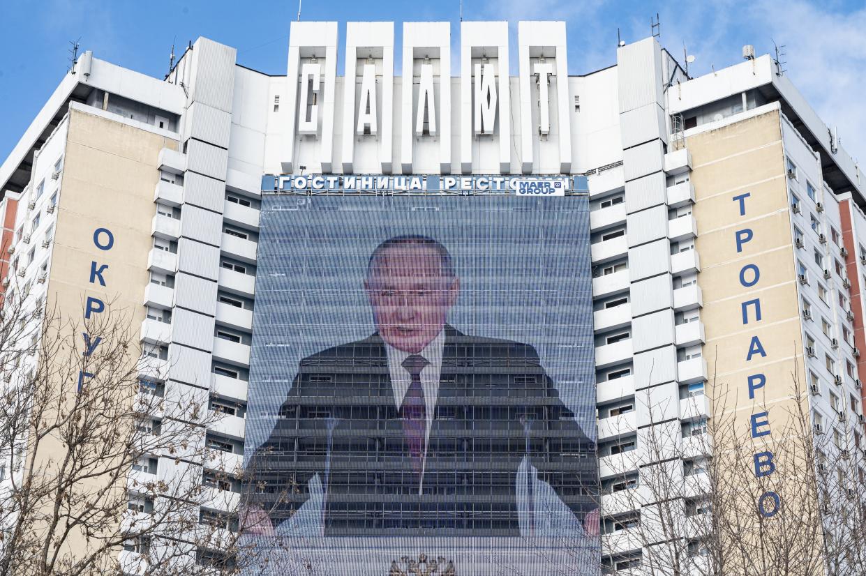 An electronic billboard on a hotel building shows Russian President Vladimir Putin giving his annual state of the nation address in Moscow, Russia, Wednesday, Feb. 22, 2023. (AP Photo/Dmitry Serebryakov)