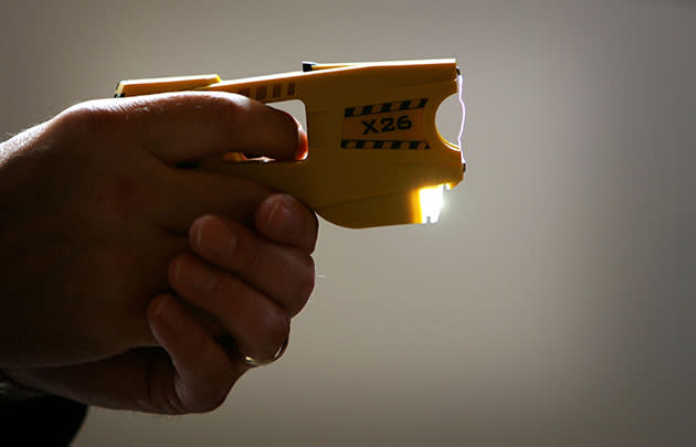 A representative from Taser International fires the latest X26 stun gun during the Police Federation Conference at Winter Gardens on May 16, 2007. (Christopher Furlong/Getty Images)