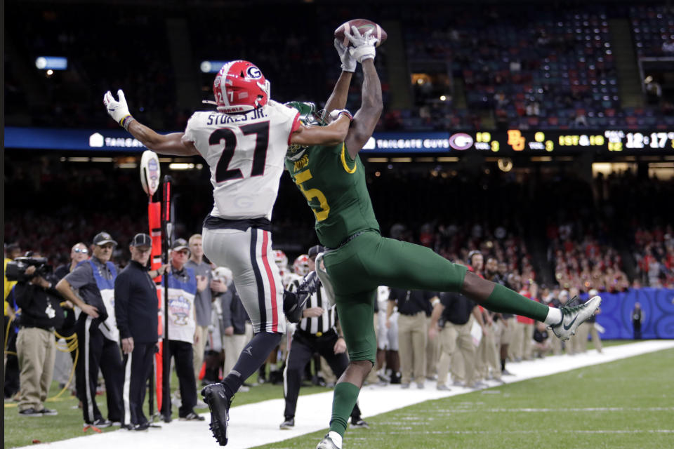 Baylor wide receiver Denzel Mims (5) pulls in a pass reception against Georgia defensive back Eric Stokes (27) in the second half of the Sugar Bowl NCAA college football game in New Orleans, Wednesday, Jan. 1, 2020. (AP Photo/Brett Duke)
