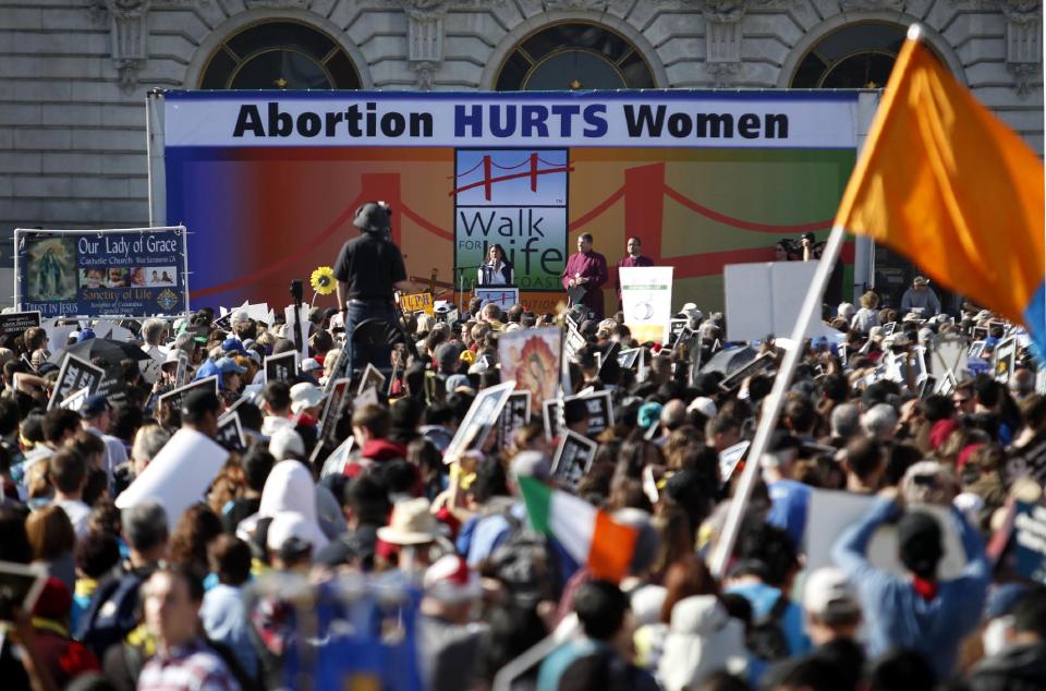 Abortion opponent Georgette Forney speaks at the "Walk for Life" rally and march, Saturday, Jan. 25, 2014, in San Francisco. Thousands of abortion opponents marched through downtown San Francisco for the 10th annual "Walk for Life West Coast." The protesters rallied at Civic Center Plaza in front of City Hall before marching down Market Street to Justin Herman Plaza. (AP Photo/Beck Diefenbach)