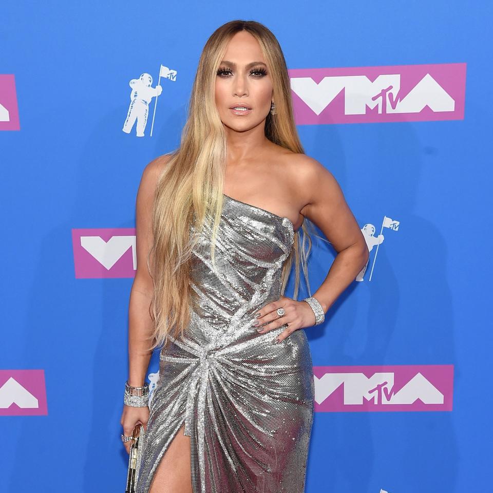 Jennifer Lopez wears a silver Versace dress and brings Alex Rodriguez for her historic night.