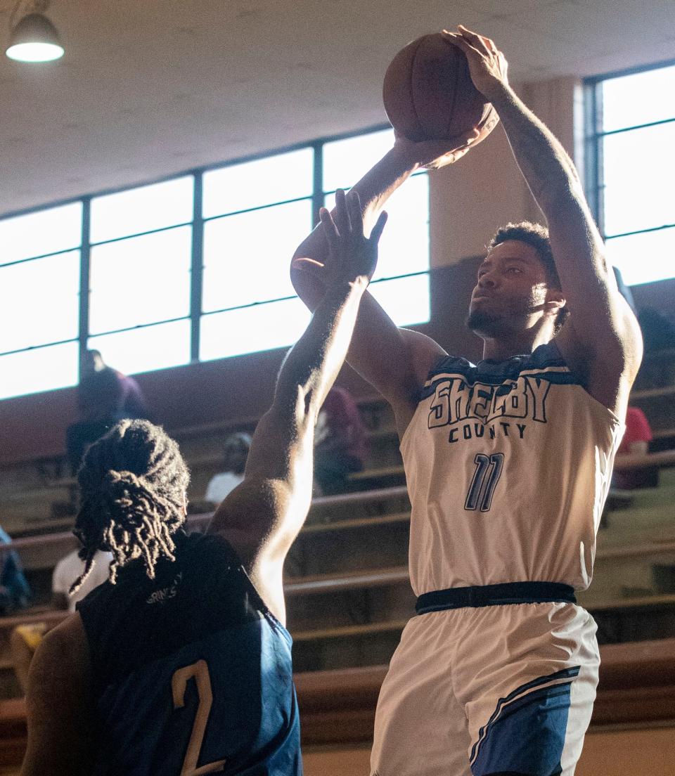 Shelby County Pro-Am white team’s Jayden Hardaway (11) shoots a basket while being guarded by blue team’s Anthony Green (2) during a game Wednesday, July 20, 2022, at Orange Mound Community Center in Memphis. The Shelby County Pro-Am is a basketball league that features both current and former college and professional basketball players.