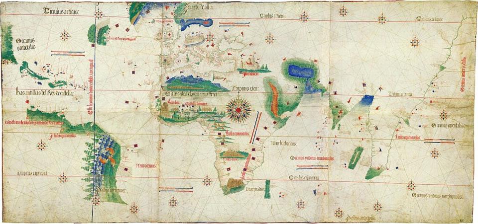 An old-fashioned map of the world with several sections in vivid green and blue.