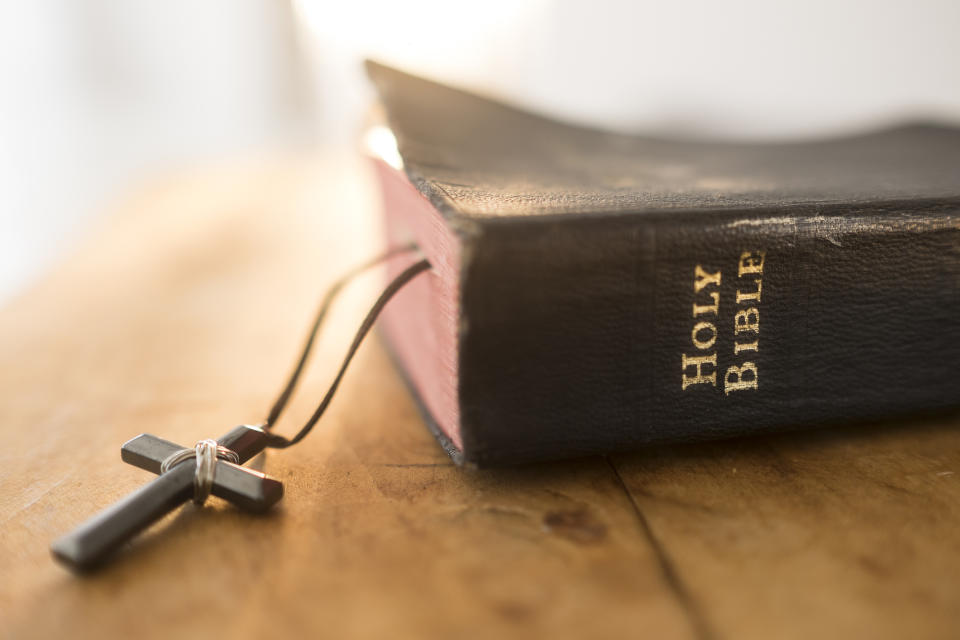 Close-up of a Holy Bible with a cross on its side