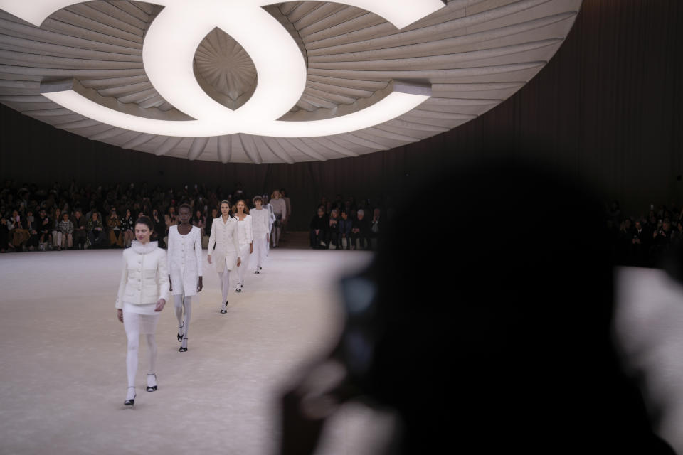 Models wear creations for Chanel as part of the Haute Couture Spring-Summer 2024 collection presented in Paris, Tuesday, Jan. 23, 2024. (AP Photo/Thibault Camus)