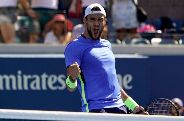 Matteo Berrettini celebrates his five-set win